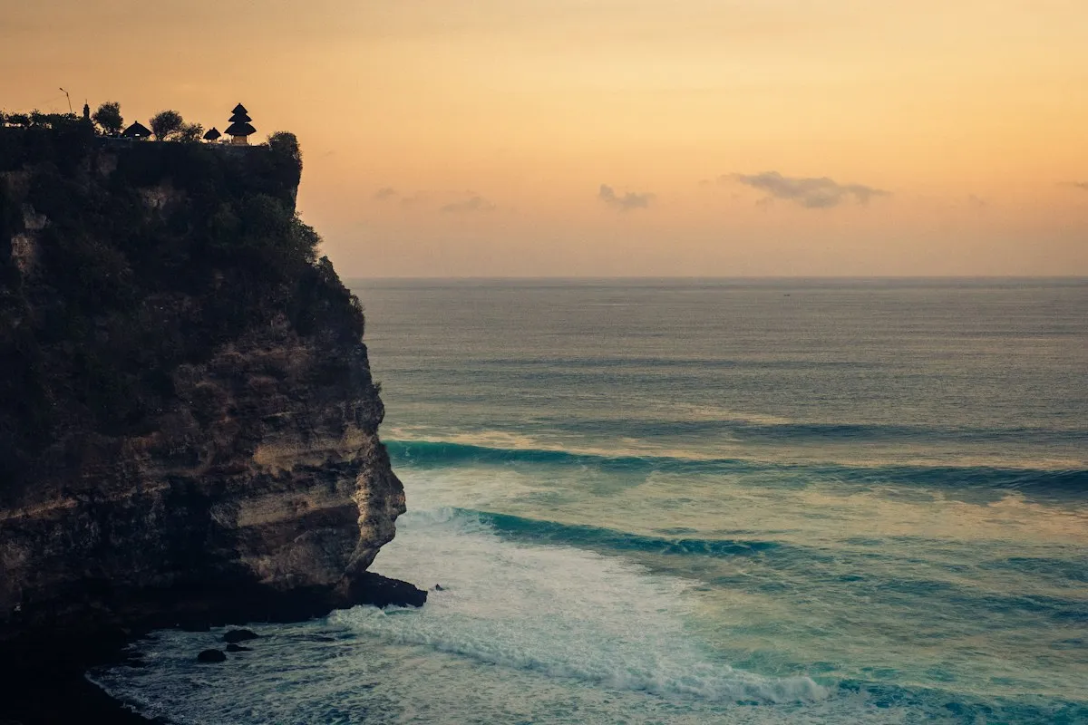 Uluwatu clifftop above the ocean at dusk in Bali